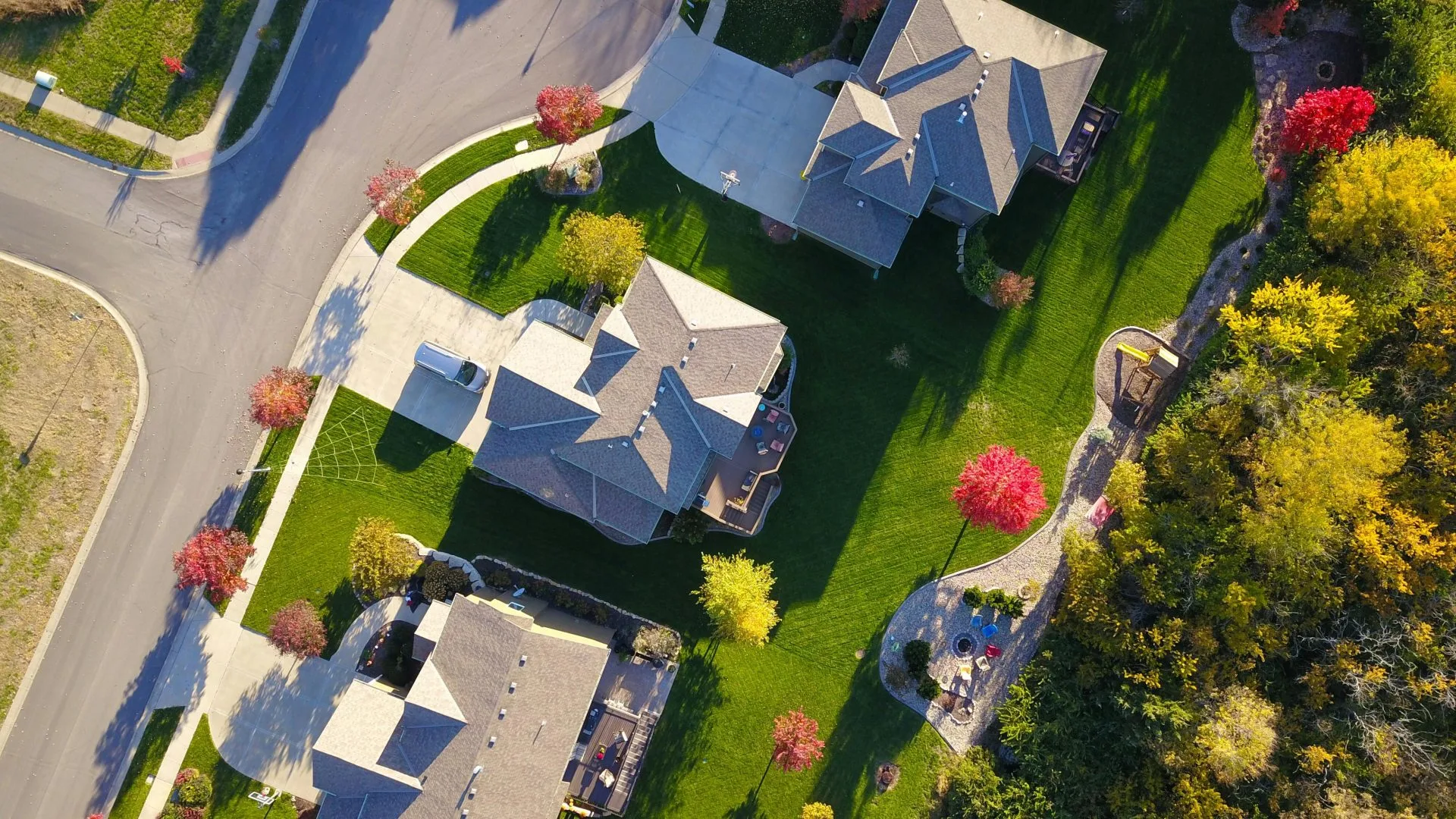 Aerial view of Beaumont neighborhood with autumn trees and playground