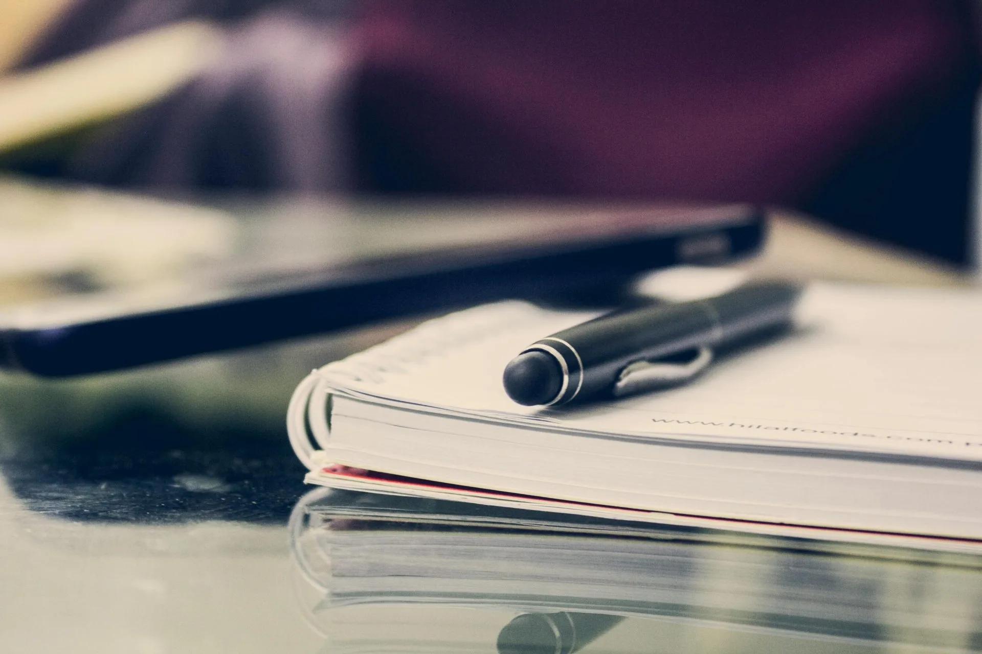 Notebook and pen ready for client consultation at Beaumont legal office