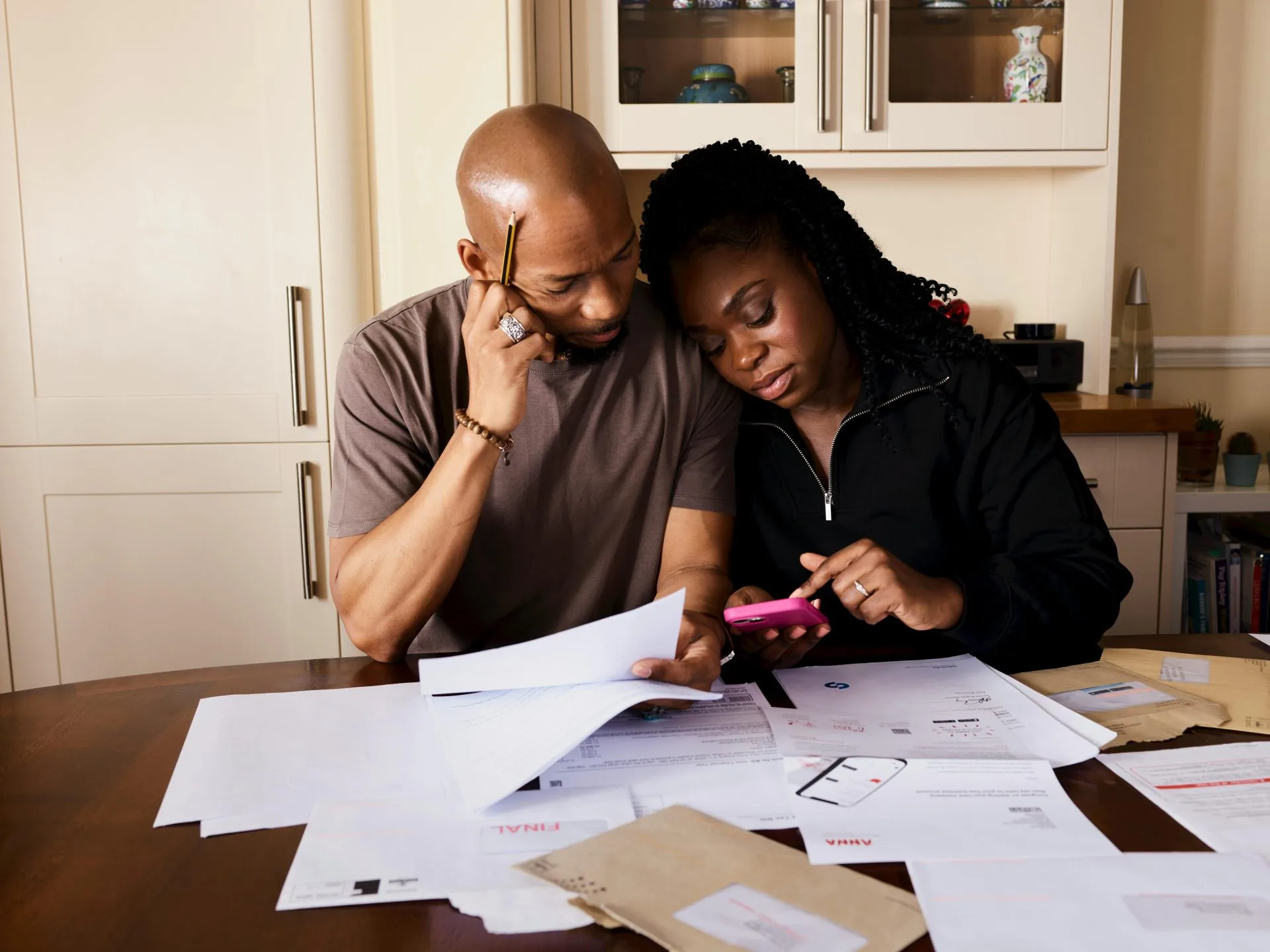 Edmonton couple discussing real estate finances for informed decisions